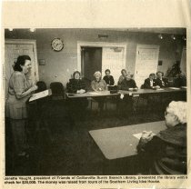 Janette Vaught Presents Library with Check