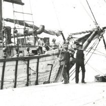 Ship on dock with marsh grass