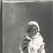 Baby Theo Davis in white dress