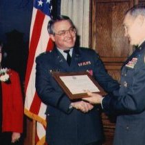 Yates receiving Merit