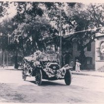 Decorated car on Centre Street, Keystone Hotel in background,