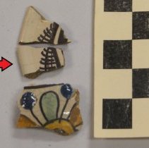 black glazed patterned potsherd