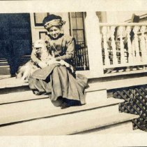 unidentified lady on steps with dog