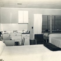 Photograph of the interior of a bedroom at Seaside Inn