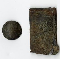 Button and metal plate found at the residence of Lee Jordan