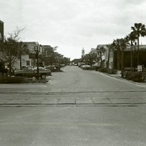 Downtown; Docks with Shrimp Boats
Old Downtown Business; possibly boathouse on 3rd street

Woman with Bottle at Old House; date unknown

Main Beach