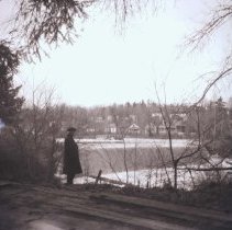 Man Looking at Goldie's Mill Dam, 1918