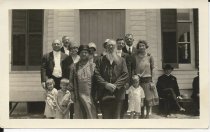 Rev. E. Rowoldt (behind man with beard) & wife