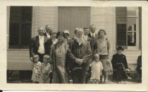 Rev. E. Rowoldt & wife (standing behind man with beard)