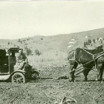 Automobile Pulled out of the Mud by a Horses