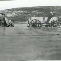 Automobile Pulled from Stream by Horses