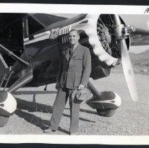 Forest Service Man in Dress Uniform beside airplane