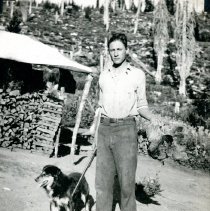 Bill Samsel and his Dog, holding a Grouse