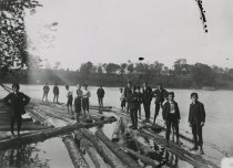 Boys on logs in Saco River