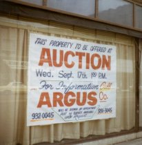 Auction sign in Hammond window front circa 1969
