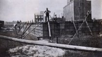 Worker standing on the foundation of the Lever Brothers plant