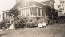 Two women in front of a house on Detroid Street