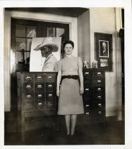 A library staff member standing in the Picture Room of the Bridgeport Public Library