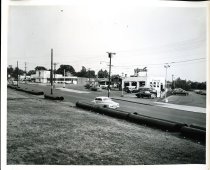 View of Boston Avenue with Sunoco gas station and parking lot