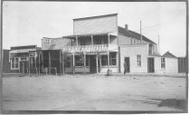 East 100 block of Gillette Avenue showing the Dodd House and Turf Saloon.