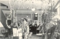 Sam Goings behind the Goings Hotel front desk in the lobby