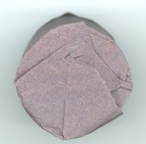 Bandage (wrapped in paper, unused)