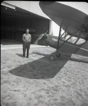 Unknown man by Jim Fulkerson's plane