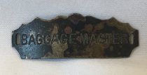 1999.015.001 - Baggage Master Hat Plate