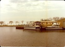 Boats docked behind 110 N. 3rd Street, Esc.