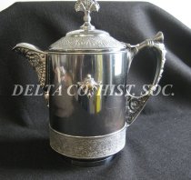 Meriden silver tilting pitcher (side view)