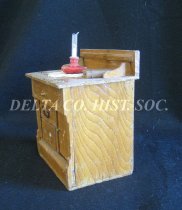 Doll chest, side view