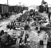 C & NW Railyards with workers working on wheel assemblies