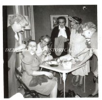Group of women decorating hats