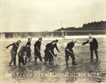 1935 Smelt Queen and Court standing in the Escanaba River near Dam No. 1