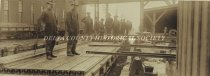 Loading steel rails on the Soo Line dock in Gladstone, 1909