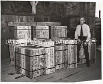 Herbert Kirstin with stump puller packing crates