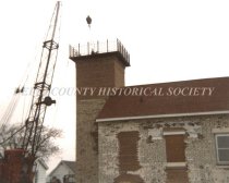 Installing the catwalk on the Sand Point Lighthouse