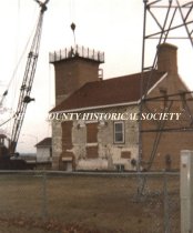 Installing the catwalk on the Sand Point Lighthouse tower
