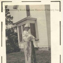 Unidentified Child Sitting on a Tree Stump