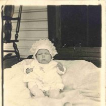 Unidentified Baby on a Blanket on a Porch