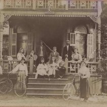 Family in front of cottage