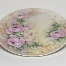 Platter painted with purple roses by Ella Bemis; 1911