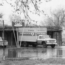 Tortilla Flat restaurant & moving truck, during threatened flooding, April