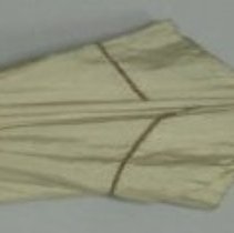 Beige cotton parasol with wooden handle.