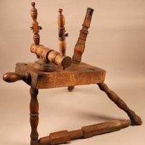 Wooden spinning wheel with most parts missing; c.1810.