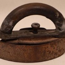 Sadiron with wooden handle.