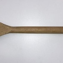 Light-colored, short-handled, wooden laundry fork; unknown date.
