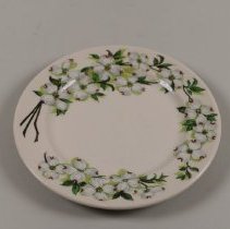 Ceramic salad plate with dogwood flower motif; unknown date.