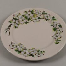 Ceramic dinner plate with dogwood flower motif; unknown date.