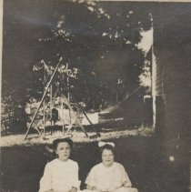 Two girls sitting on the grass